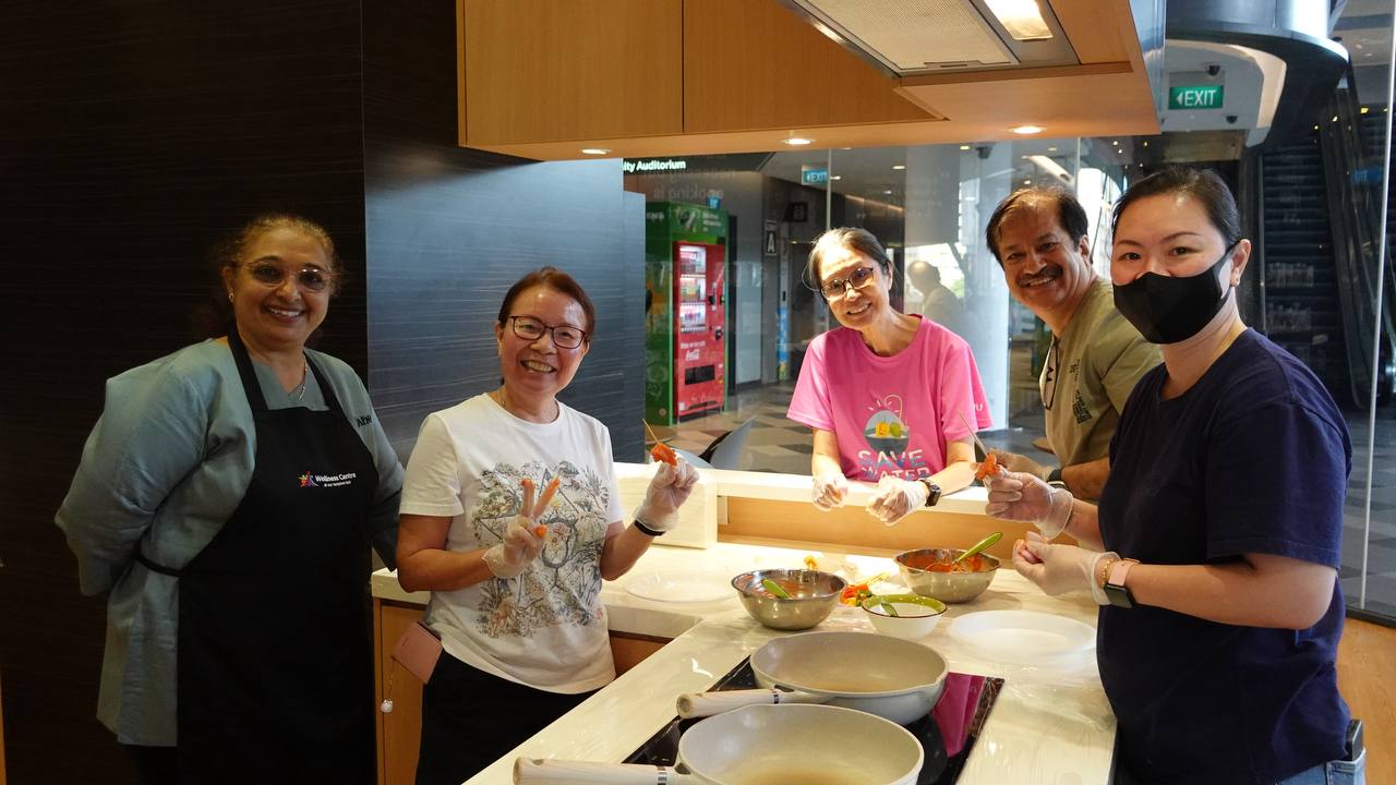 Attendees enjoying their freshly cooked chicken tikka