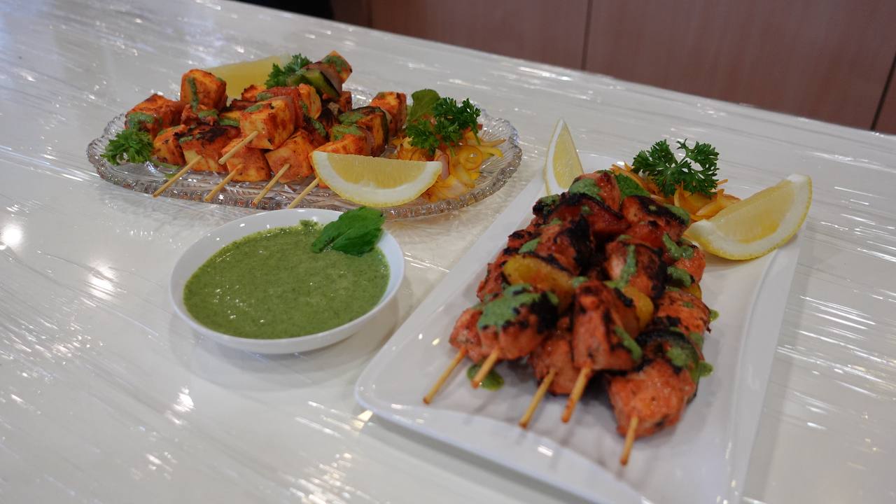 Chef Sapna demonstrating tikka preparation techniques
