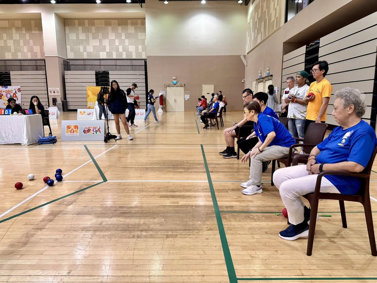 Athletes in wheelchairs playing boccia at Our Tampines Hub
