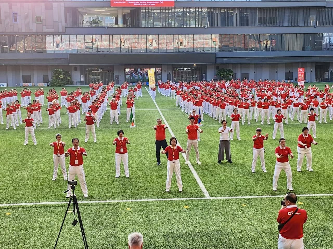 Participants performing Qigong in unison at Town Square.