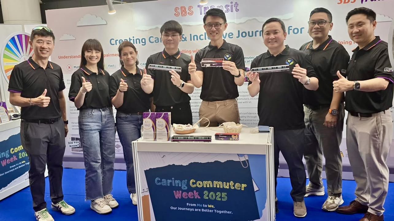 Participants interacting at an informational booth during the event