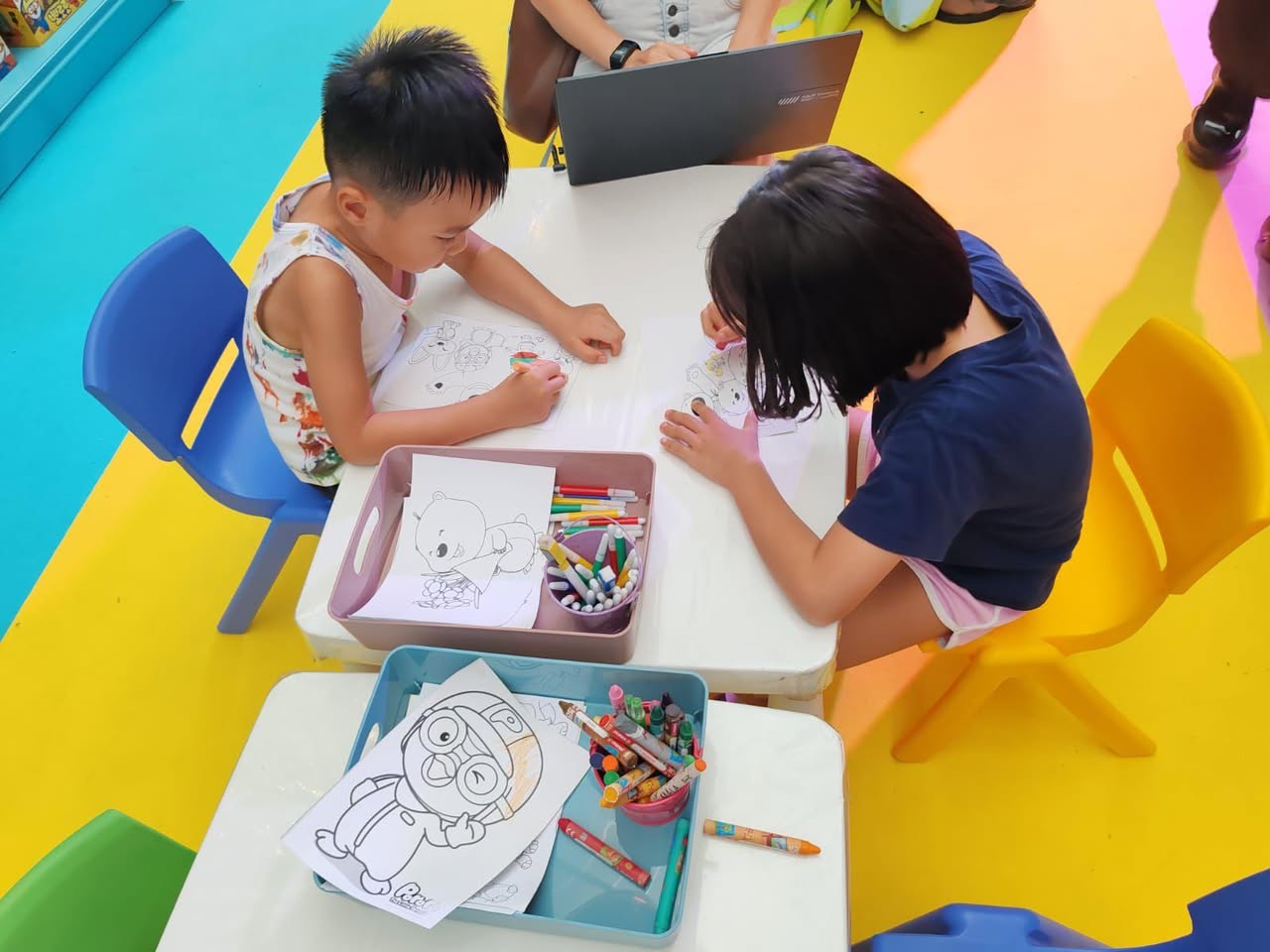 Pororo and friends greeting kids at an event