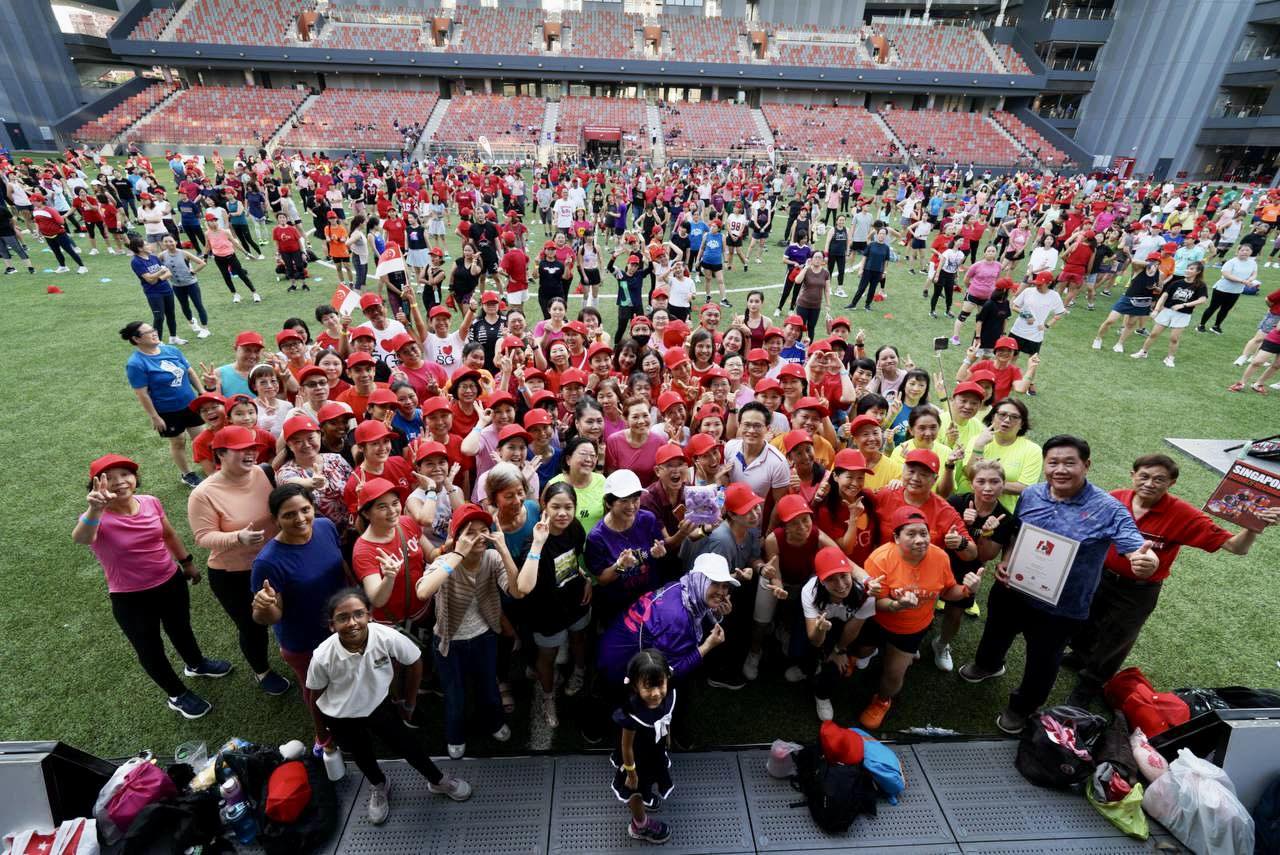 A large crowd gathers for the record-breaking KpopX Fitness celebration