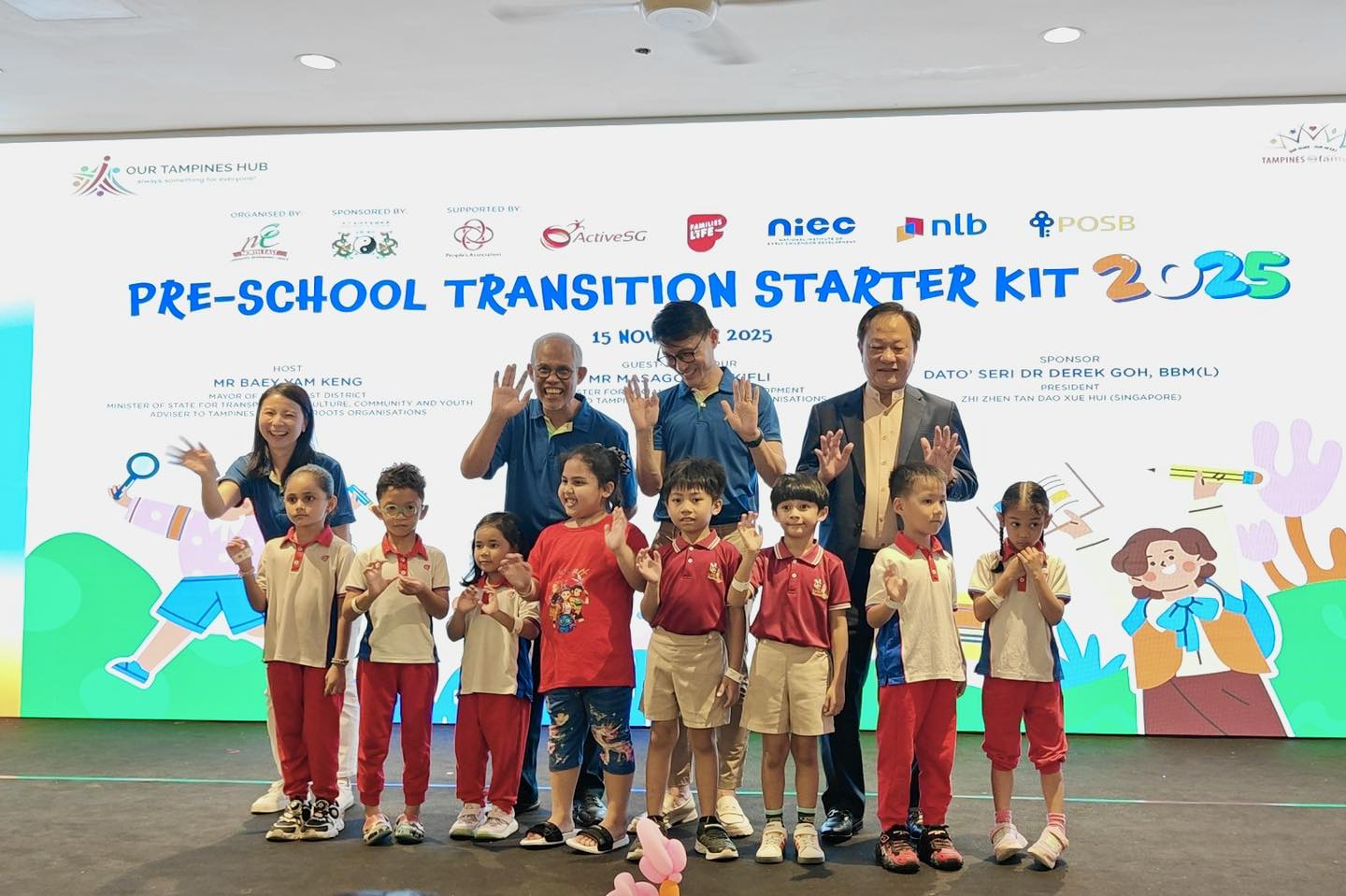 Children enjoying a lively performance on stage at the transition event.