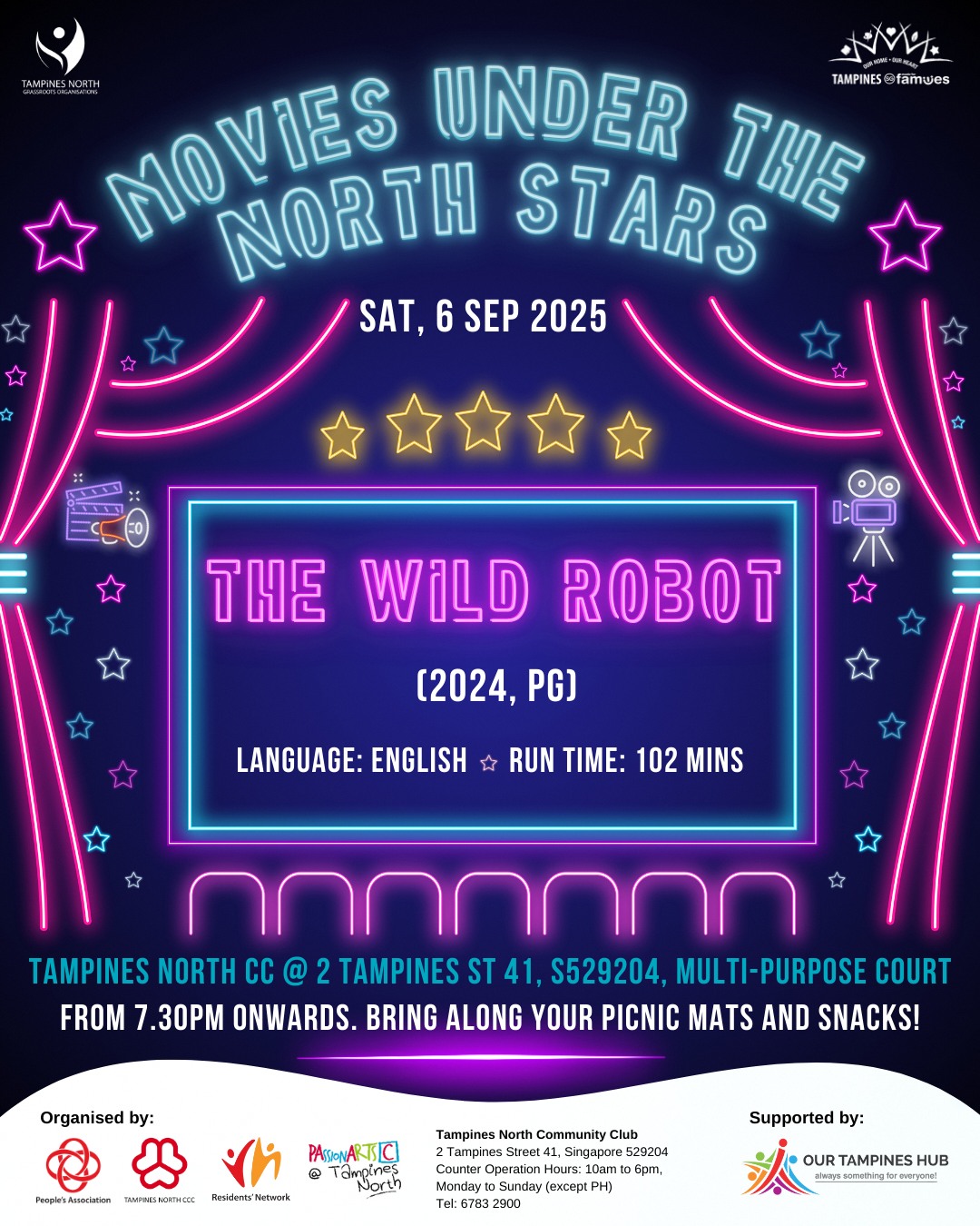 Outdoor cinema screen set up at night under a starry sky, with people gathered on blankets.