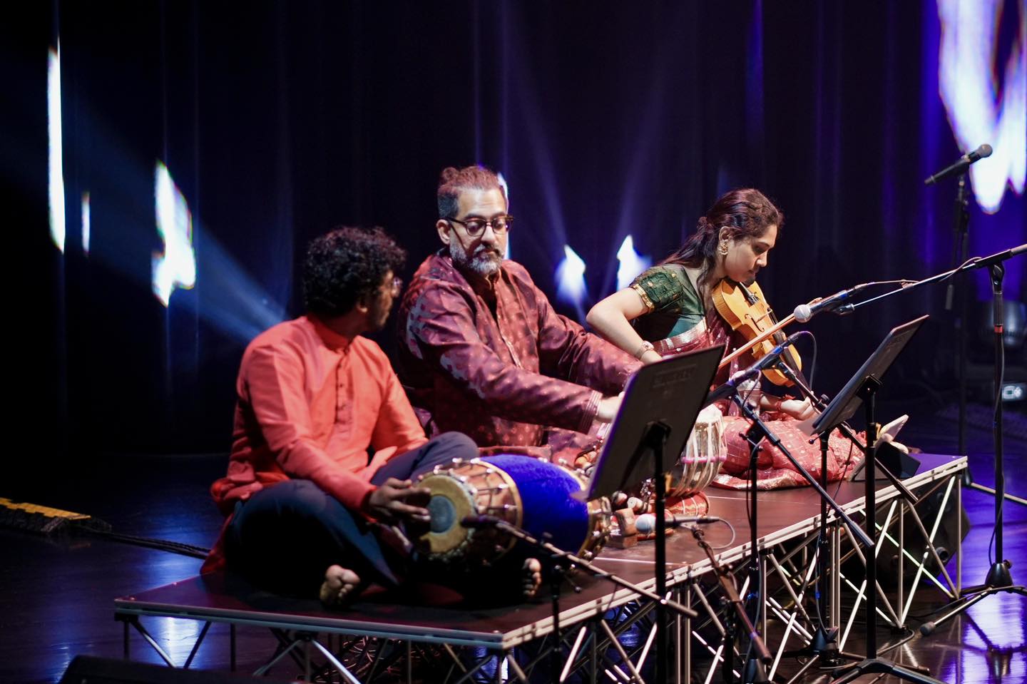 Musicians performing on stage at the Festive Arts Theatre
