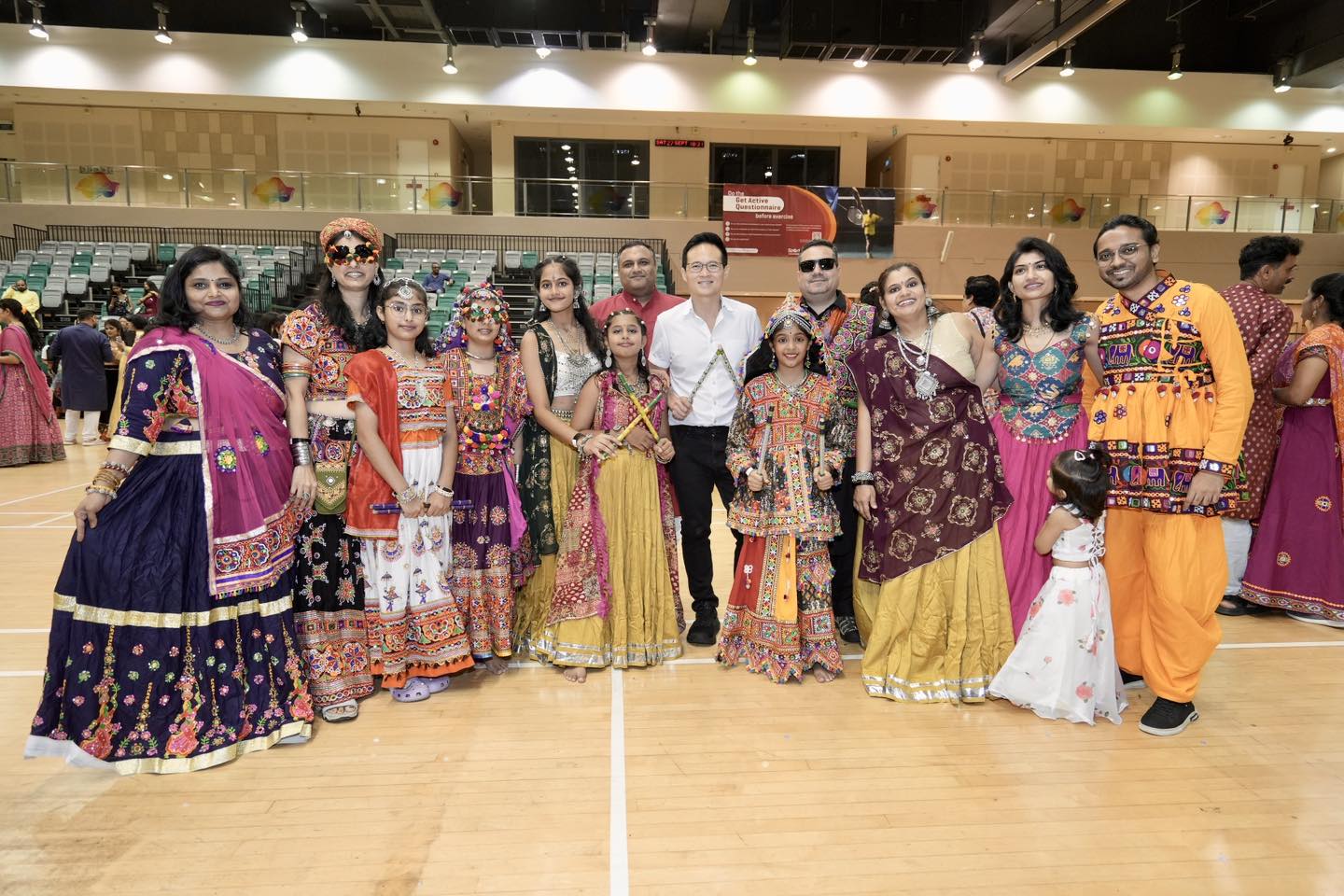 Attendees dancing with dandiya sticks at Tampines Dandiya Night