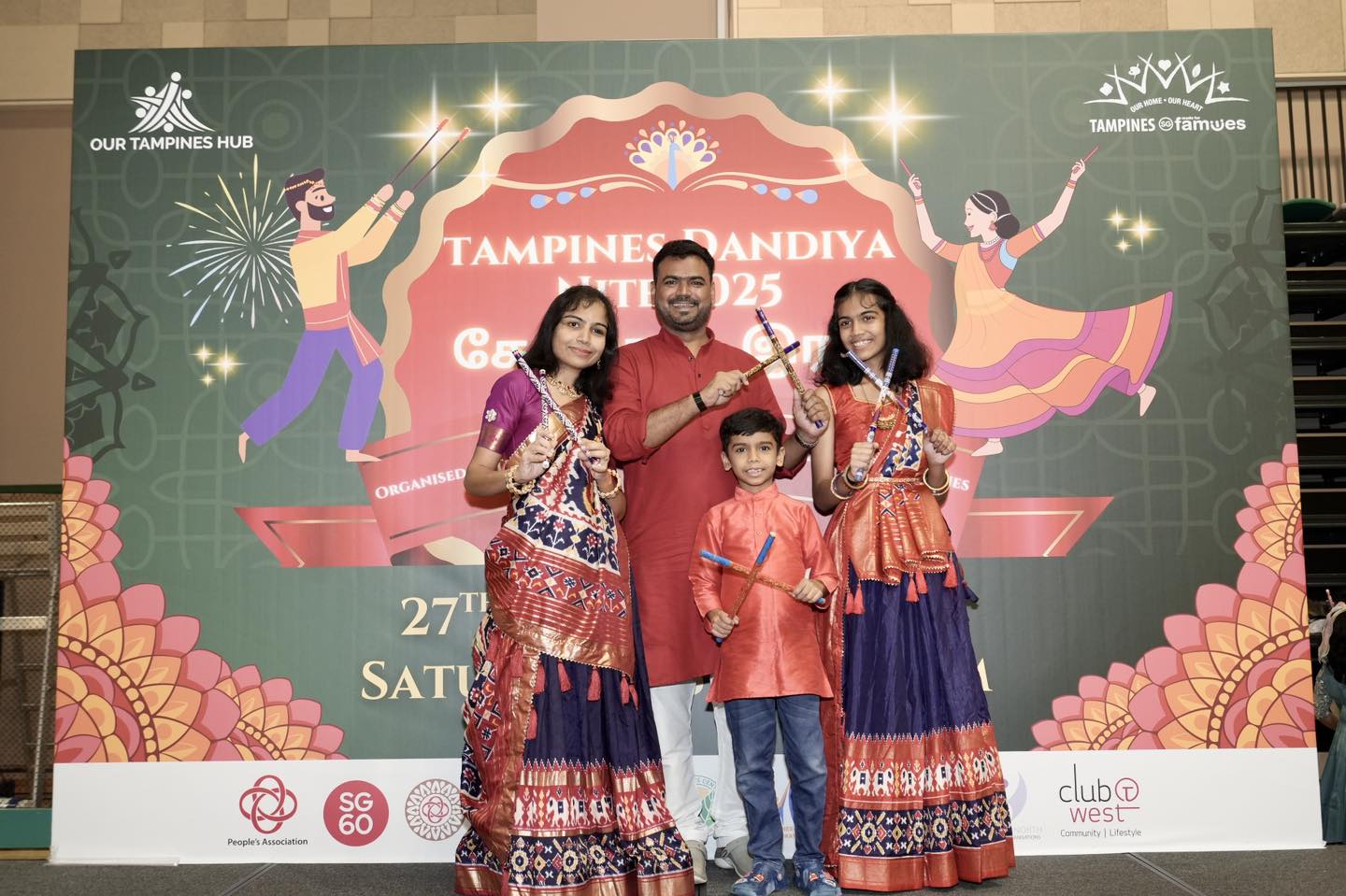 A lively group performing dandiya dance at the Community Auditorium