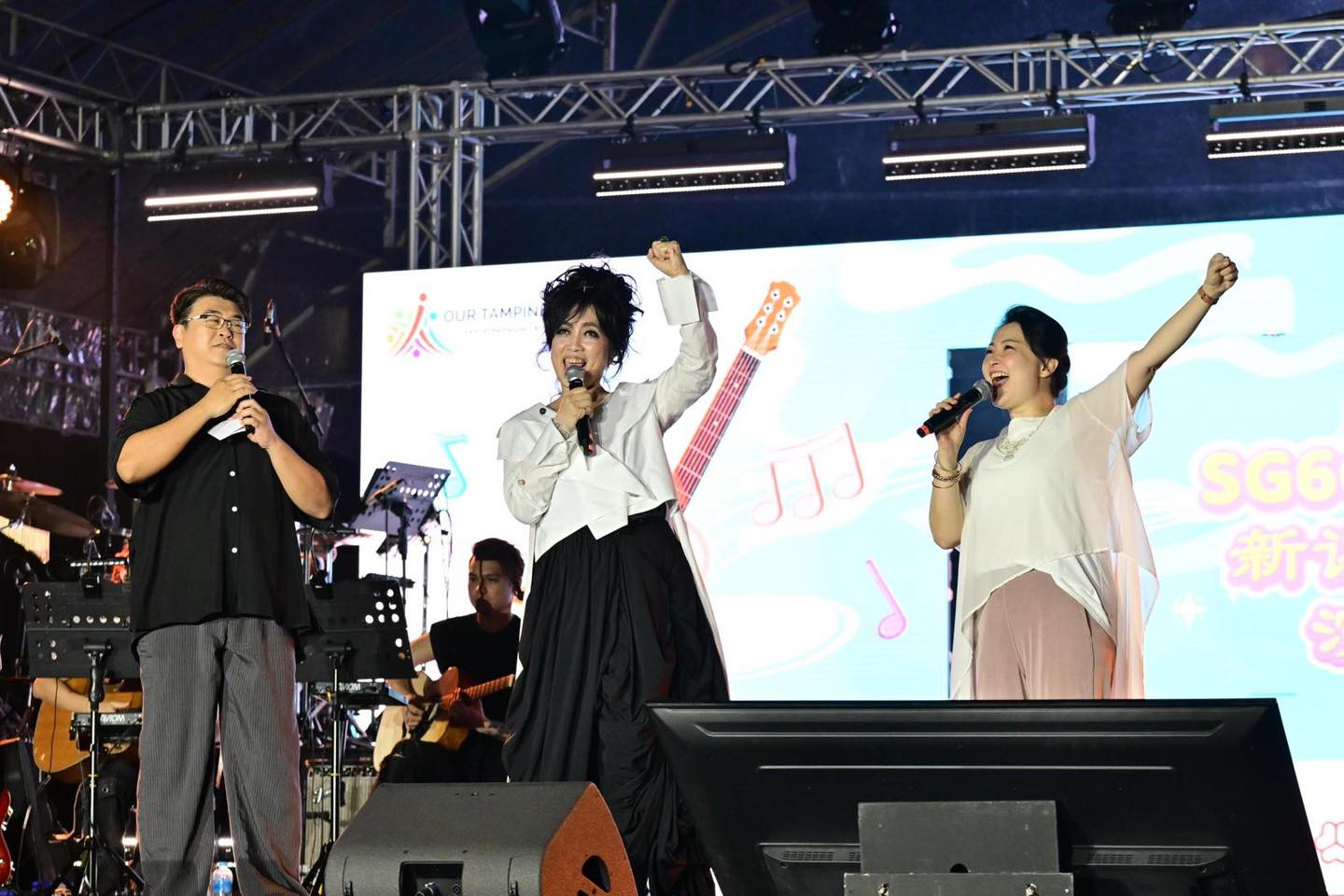 Youth volunteers engaging with seniors at the community event