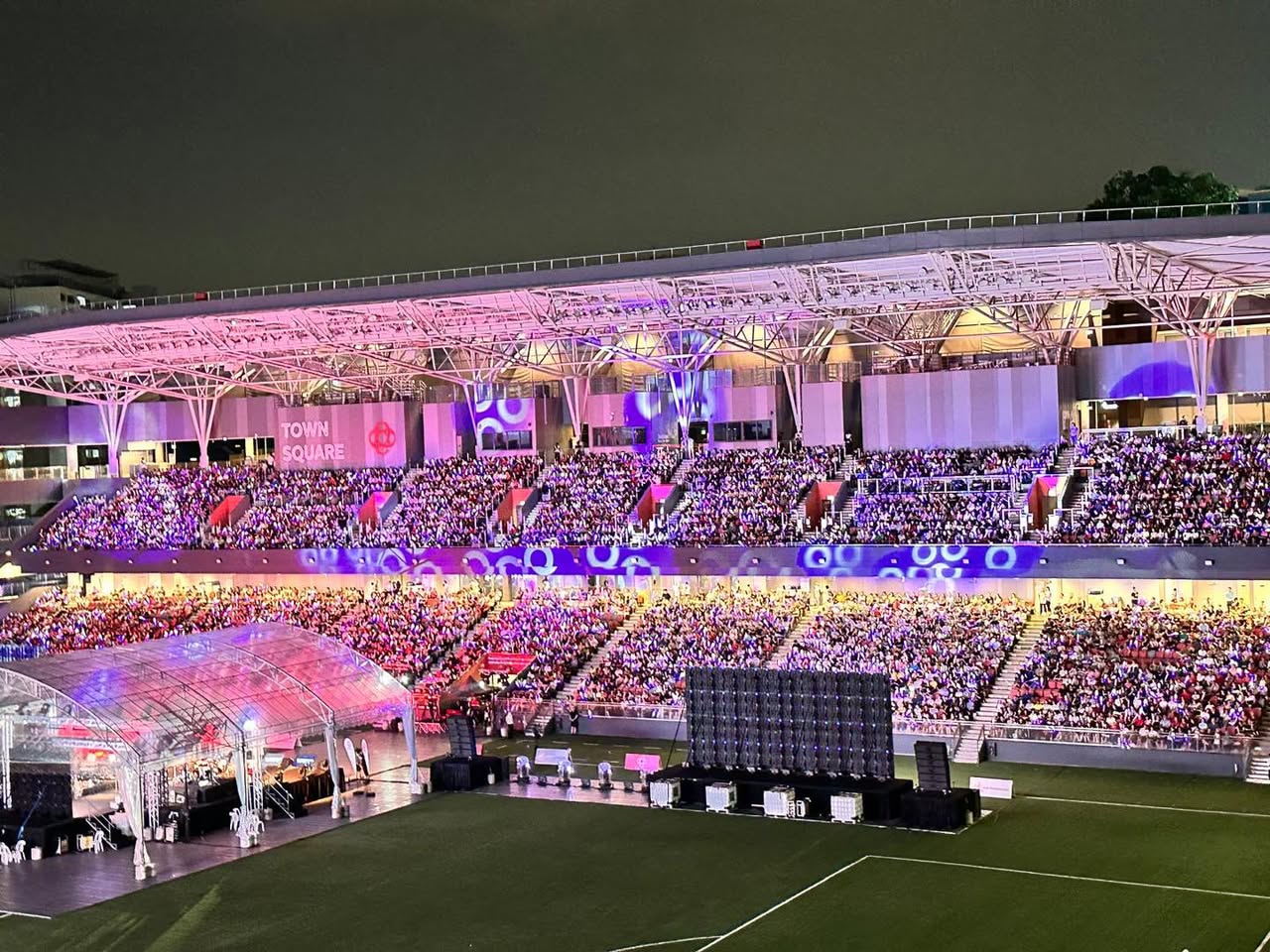 A vibrant scene from the Xinyao SG60 Concert, highlighting community spirit